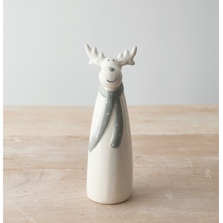 A charming and simple ceramic reindeer character dressed up in a grey dotted scarf 