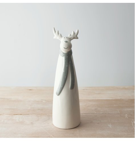 A charming and simple ceramic reindeer character dressed up in a grey dotted scarf 