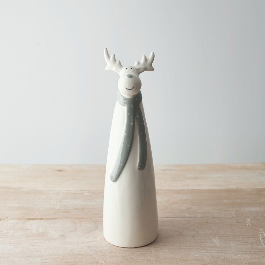  A sweet and simple tall standing ceramic reindeer complete with a grey nose and matching grey dotted scarf 