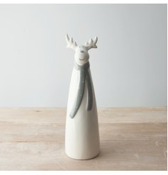  A sweet and simple tall standing ceramic reindeer complete with a grey nose and matching grey dotted scarf 