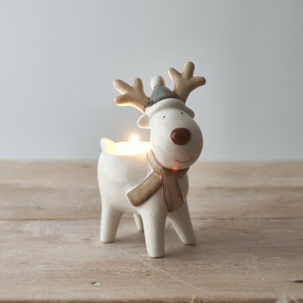 A sweet and simple posed ceramic reindeer set with grey and beige tones, a festive red nose and space for a Tlight holde