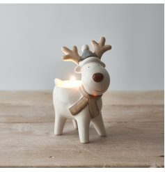 a small ceramic reindeer with a red nose and tlight holder space
