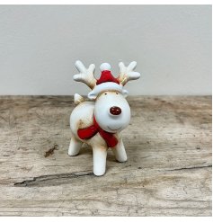  A delightful decoration to bring to the home during Christmas time, a ceramic reindeer with festive tones and a red nos