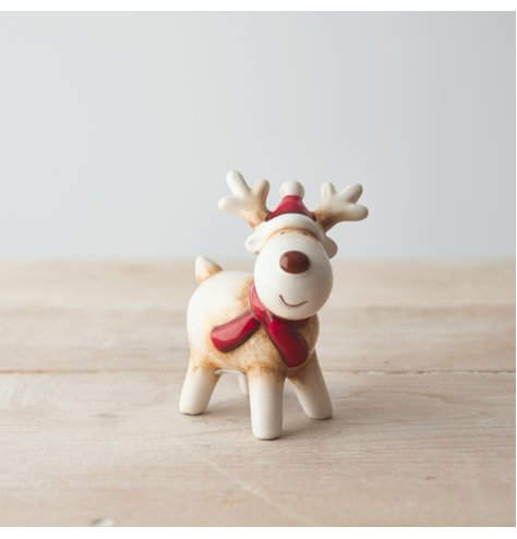 A sweet and simple white reindeer with a red nose, a charming character decoration to place in the home 