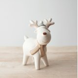 A sweet standing ceramic reindeer with neutral colour tones and a red nose to complete his look 