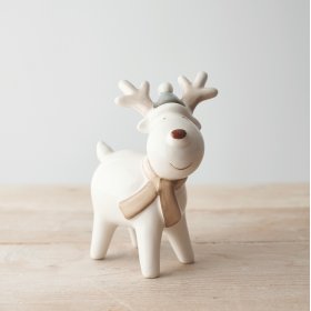 A sweet standing ceramic reindeer with neutral colour tones and a red nose to complete his look 