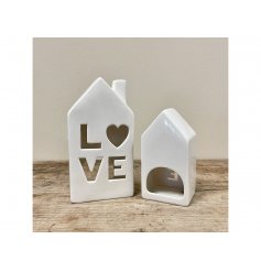 A simply charming home t-light holder with a Love cut out decal.
