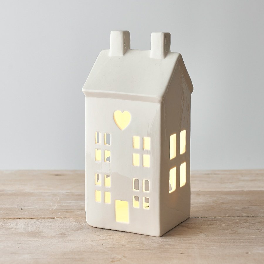 A charming ceramic house t-light holder 