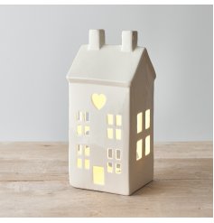A charming ceramic house t-light holder 