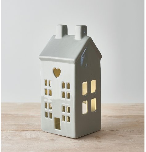 A Ceramic T-Light Holder in a Grey House Design and Heart Cut Out Decal