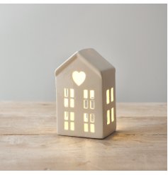 A sweet little ceramic house with LED lights