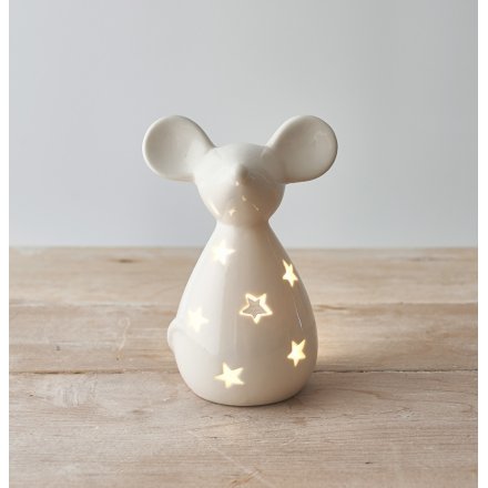 A charmingly simple ceramic mouse decoration with a sleek white glaze and cut star decal 