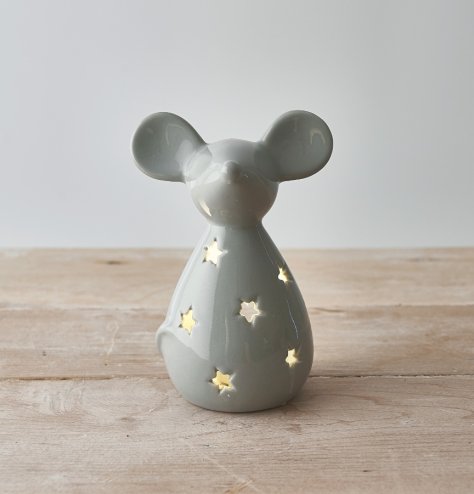 A sweet and simple mouse shaped tlight holder with a star cut decal and sleek grey tone  