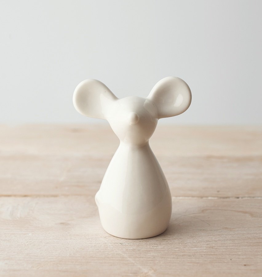   A small and simple white glazed ceramic mouse decoration 