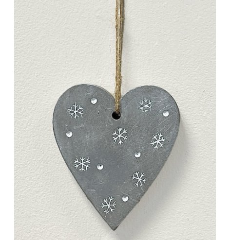 A sleek and simple concrete based heart hanger beautifully detailed with an embossed snowflake and dot decal 