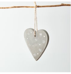  A small distressed concrete heart hanging decoration set with white embossed snowflakes and dots 
