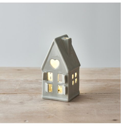 A wonderfully simplistic grey ceramic house t-light holder, finished with cut out windows, doors and a small dainty star