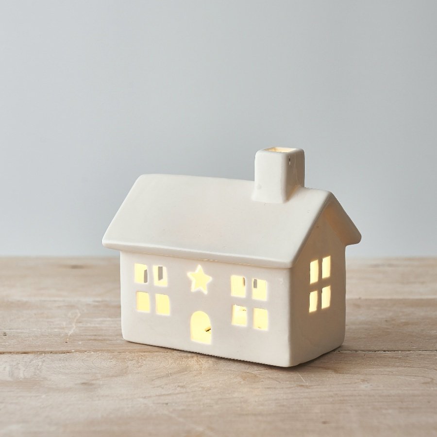 A charmingly simple ceramic house decoration complete with a warm glowing LED centre 