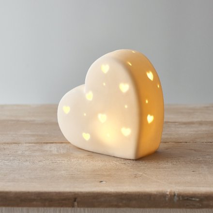 A simplistic Ceramic Heart ornament with an illuminating LED Centre display 