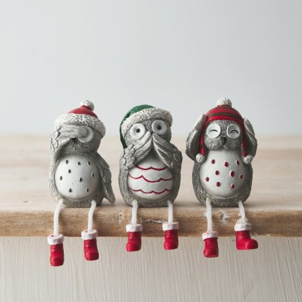 A fun and festive mix of shelf sitting Owl figures with pops of traditional colours on a grey base tone 