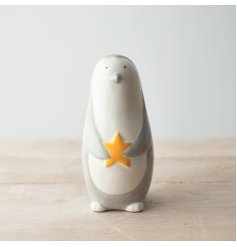 A fun and friendly themed ceramic penguin figure, set with a smooth glaze look and simple colour tone 