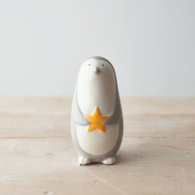 A fun and friendly themed ceramic penguin figure, set with a smooth glaze look and simple colour tone 