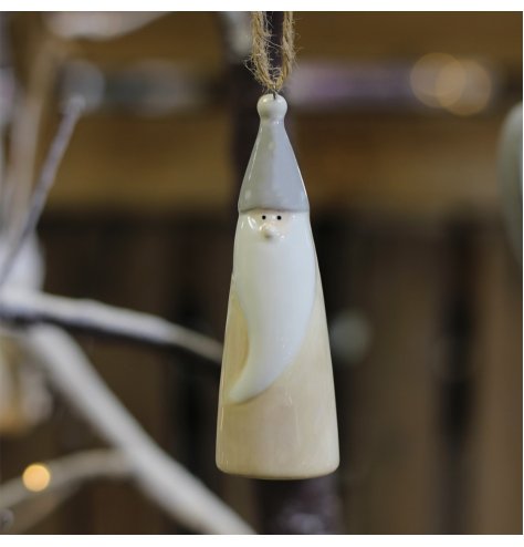 A small hanging ceramic gonk decoration set with a traditional neutral tone and smooth glaze 