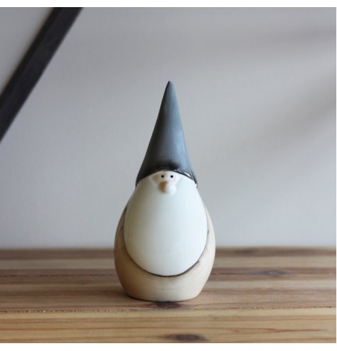 A small ceramic gonk decoration set with a traditional neutral tone and smooth glaze 