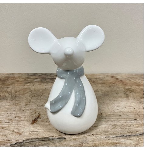 A ceramic based mouse set with simplistic features and a grey spotted scarf to complete his look 