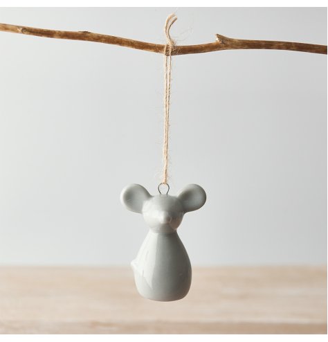 A small hanging ceramic mouse decoration set with a simple grey smooth glazing 