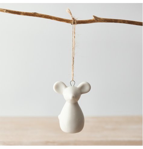 A small hanging ceramic mouse decoration set with a simple white smooth glazing 