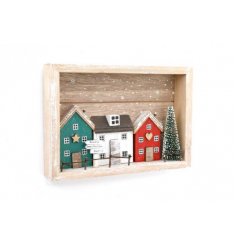 A traditional toned wooden framed plaque set with a red and green house scene 