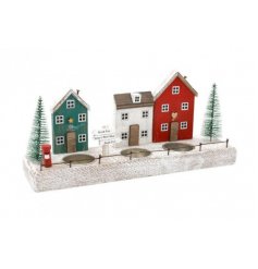  A charming T-light holder decorated with a festive red house scene with an added bristle tree 