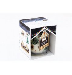  A glass candle pot complete with a festive Christmas Market printed  packaging and surrounding design 