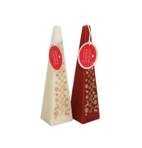 An assortment of pyramid shaped advent candles in cream and red tones 