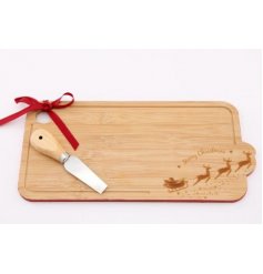 A simple wooden cheeseboard, featuring a curved shape edging and embossed Christmas scene 