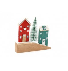  A festive themed wooden house scene with traditional festive tones and added bristle tree detail 