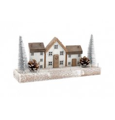   A festive themed wooden village display, set with Scandi inspired colour tones and festive decals 