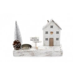 a rustic house display with an added tlight holder space   A festive themed wooden village tlight holder display, set wi