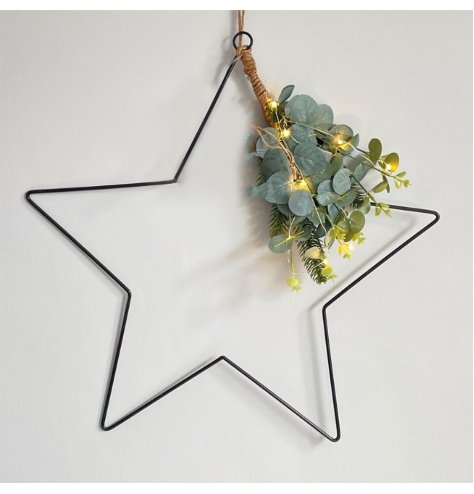 An attractively simple star shaped hanging decoration with a warm glowing LED string of lights and foliage finish 