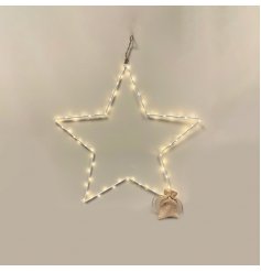 An extra large white metal wire star decoration with warm glowing LED lights and a hessian battery bag 