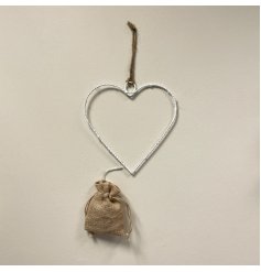 A sleek and simple white wire heart entwined with warm glowing LED Lights 