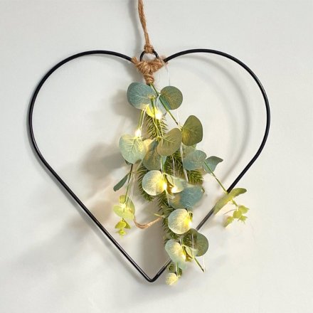   A stunningly simple black wire heart entwined with warm glowing LED Lights and a foliage finish 