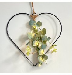  A stunningly simple black wire heart decoration with LED lights, hessian battery bag and entwined eucalyptus leaves 