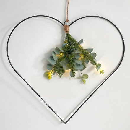 A stunningly simple black wire heart decoration with LED lights, hessian battery bag and entwined eucalyptus leaves 