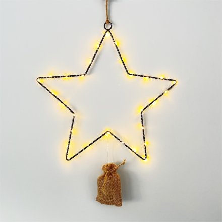 A stunning black wire star decoration with LED lights and a hessian battery bag 