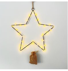 A stunning black wire star decoration with LED lights and a hessian battery bag 