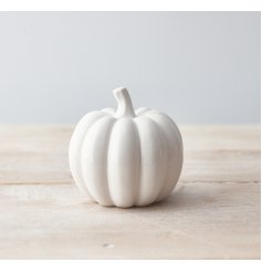 A sleek, simple and stylishly set ceramic pumpkin 