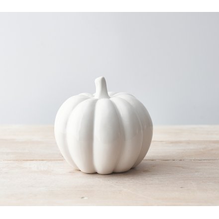  Sure to bring a sleek look to any home space or festive display, a stylishly simple ceramic pumpkin with a silver stem 
