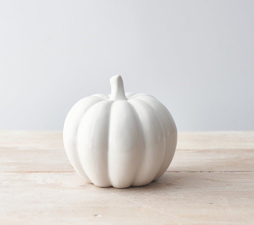  Sure to bring a sleek look to any home space or festive display, a stylishly simple ceramic pumpkin with a silver stem 